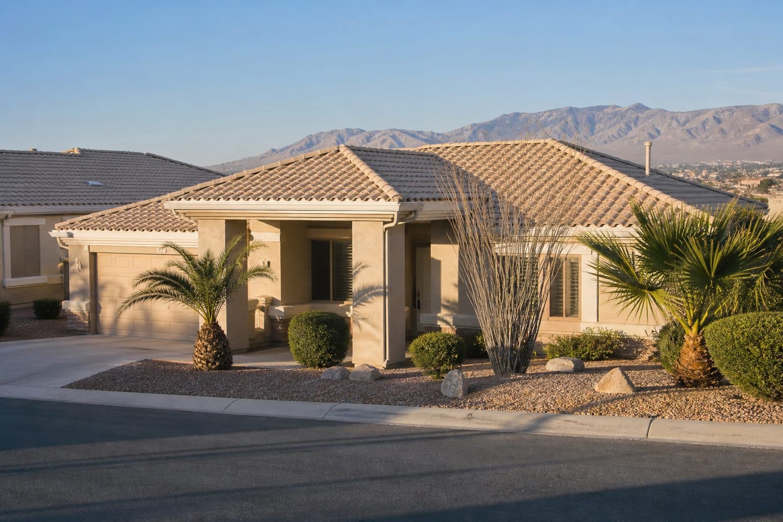 Single-level stucco ranch with a covered, zero-step front walk in a Las Vegas Valley 55-plus street.